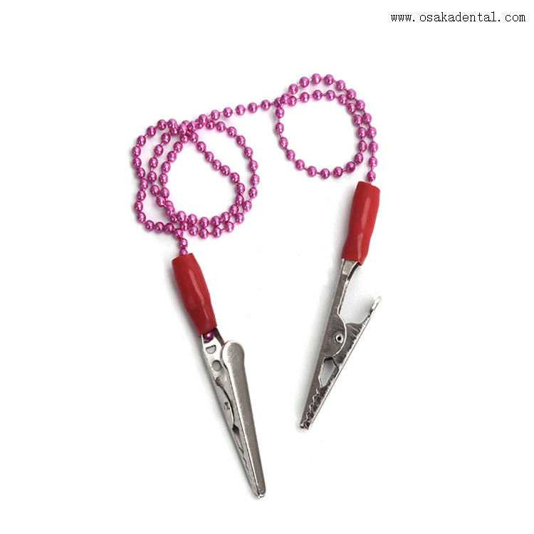 Porta babero dental desechable con clip metálico