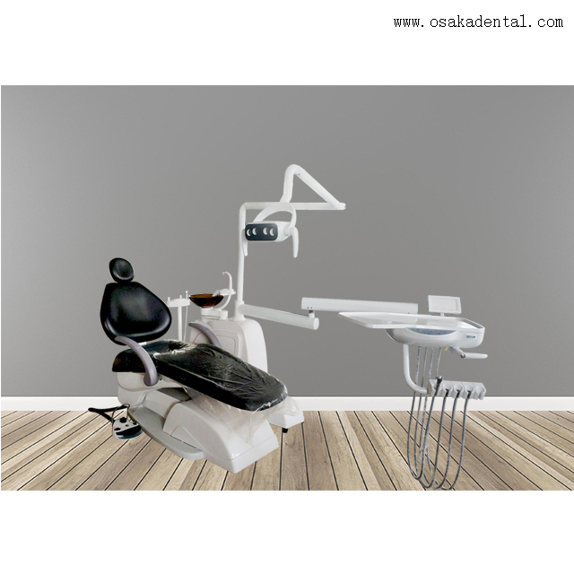 Silla dental de color negro con compresor de aire dental