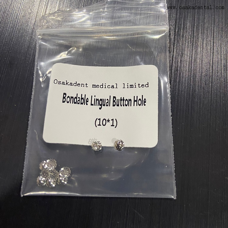Ojal lingual adherible de ortodoncia dental