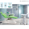 Unidad de sillón dental de color verde con compresor de aire dental y pieza de mano dental