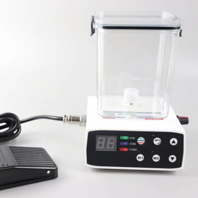 Motor eléctrico dental con tanque de agua y pedal.